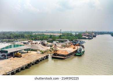 Surat Thani - April 12, 2022 - Aerial Time Lapse View Of An Excavator Working On A Carrier Boat At Tapi River In Surat Thani, Thailand