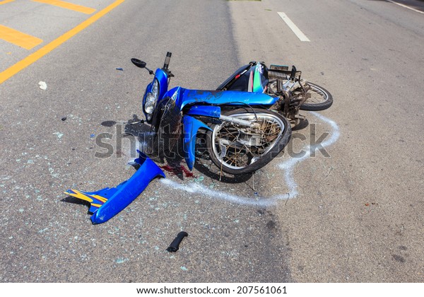 SURATTHANI - JULY 18 : Motorcycle\
accident on the road and crashed with other car which causing the\
rider serious injury on July 18, 2014 in Suratthani,\
Thailand.