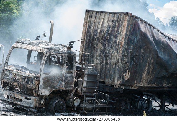 SURATTHANI THAILAND- AUG 17:\
Police firefighter rescuers helped extinguish a burning tractor\
trailer trucks horn pure alcohol on Aug 17,2014 in suratthani\
province,thailand