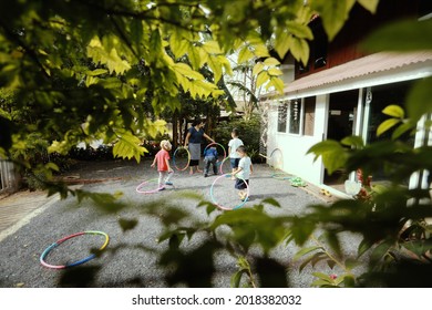 SURATTHANI, THAILAND - OCTOBER 30, 2017:Group Of Little  
 Asian Kids Playing With Wooden Toys In Garden,home Schooler And Waldorf Education Concept.