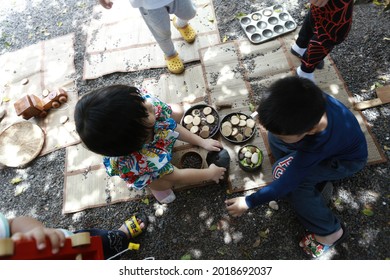 SURATTHANI, THAILAND - OCTOBER 30, 2017:Group Of Little  
 Asian Kids Playing With Wooden Toys In Garden With Soft Focus,home Schooler And Waldorf Education Concept.