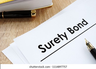 Surety Bond Form And Pen On A Table.
