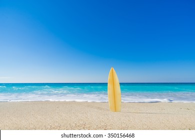 Surf Board In The Sand At The Beach