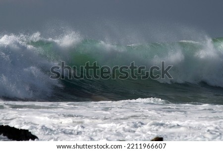 Surf breaking on the rocks
