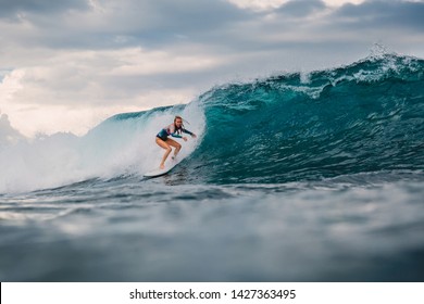 Surf Girl On Surfboard. Surfer Woman And Big Blue Wave