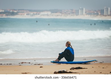 Surf Girl Seat On The Board And Look To The Lineup