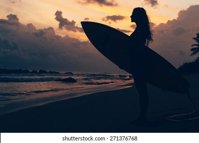 Surf girl at the sunset
