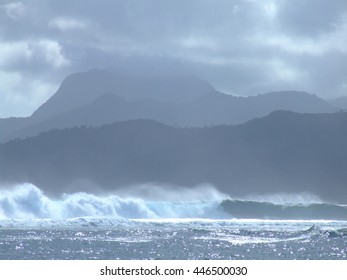 Surf On Aunuu Island In American Samoa. Rainmaker Mountain On Tutuila Island In Background.