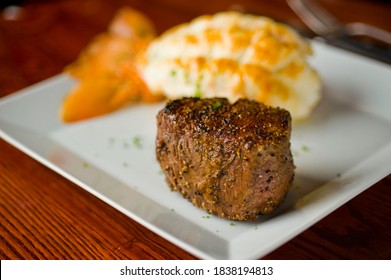 Surf ‘n Turf. Steaks And Lobster Tail. Grass Fed Angus Steak And Maine Lobster Tail Served With Traditional Steakhouse Side Dishes. Classic American Fine Dining Restaurant Entree.