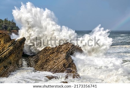 Surf waves on rock. Sea rock with surf waves