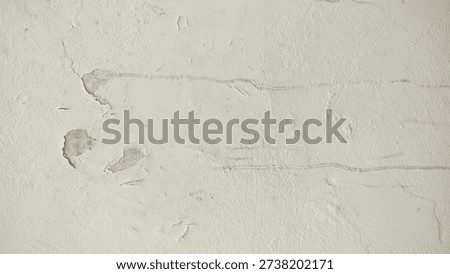 The surface or background of an old white wall with peeling paint. photo of a damp and moldy house wall. Paint used for painting non-standard house walls causes the wall paint to peel off.