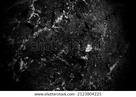 Surface of the black stone texture rough, gray-black tone. Use this for wallpaper or background image. There is a blank space for text	