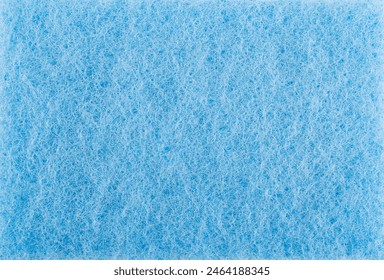 Surface of a blue cleaning sponge. Background made of blue cleaning cloth. - Powered by Shutterstock