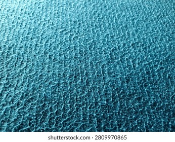 Surface blue microfiber plastic carpet mat texture. blue seamless carpet texture shot from above texture background