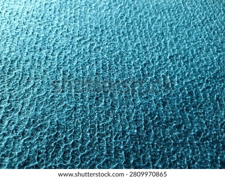 Surface blue microfiber plastic carpet mat texture. blue seamless carpet texture shot from above texture background