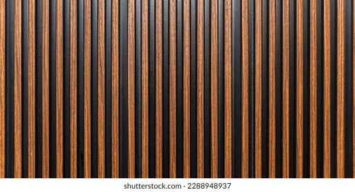 The surface of a brown wooden slatted panel. Decor and interior design, construction and renovation. Space for text. Panorama format. - Powered by Shutterstock