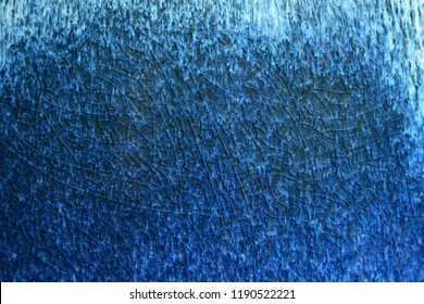 The Surface Of A Ceramic Jug, Covered With Dark Blue Glaze. 