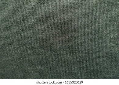 Surface Of Dark Green Jersey Fabric From Above