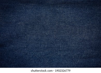 Surface Of Dark Navy Blue Denim Jeans Fabric For Background.