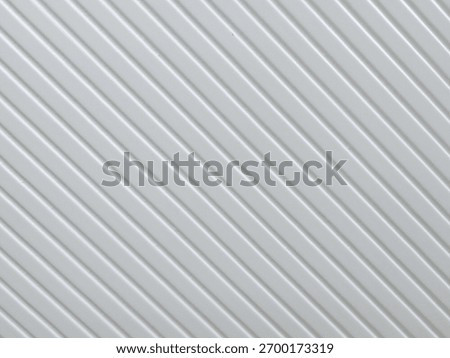 Surface features diagonal lines on a white background highlighting texture and pattern from an interior design perspective in bright lighting conditions