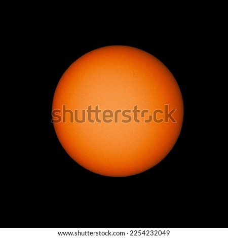 Surface granulation and sunspots seen on the solar surface, photographed through White-Light Solar Filter.