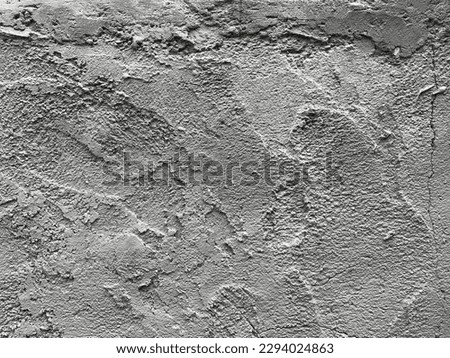 Surface of gray cement plaster closeup, grunge rough concrete texture as a background. Layers of exterior coarse sandy stucco. Old facade wall, cracked and patched finish with uneven smears pattern.