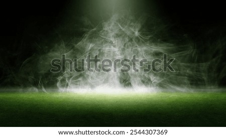 Surface of green grass. Abstract texture with smoke, mist or fog. Mockup or template. Copy space. Dark background