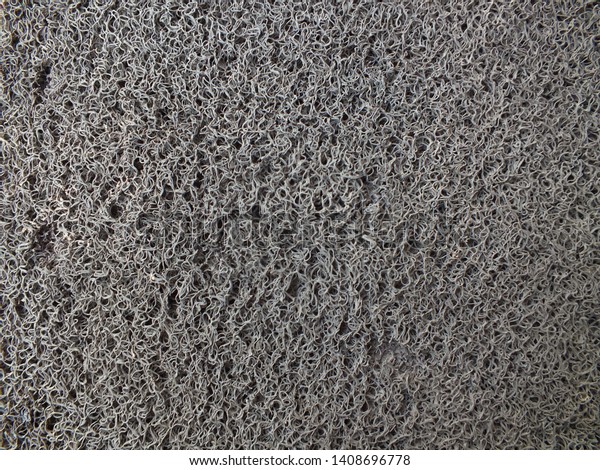 The surface of Grey car mat.( Close-up. soft and\
Selective focus)