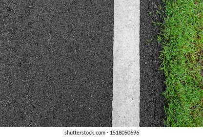 Surface grunge rough asphalt black dark grey road street and green grass texture Background,empty copy space,Top view abstract Seamless tarmac 