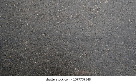 Surface Grunge Rough And Wet Of Asphalt After The Rain, Grey Grainy Road, Texture Background, Top View