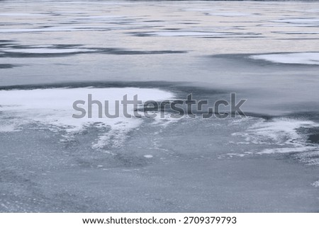 Surface ice on river in winter. Close up