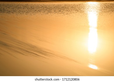 Surface of lake water with sunset reflection - Powered by Shutterstock