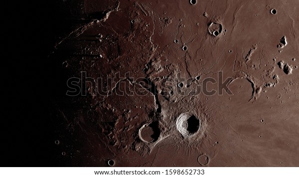 Surface of the moon close up. Craters and furrows\
on the surface of the earth\'s satellite. (Elements of this image\
furnished by NASA)