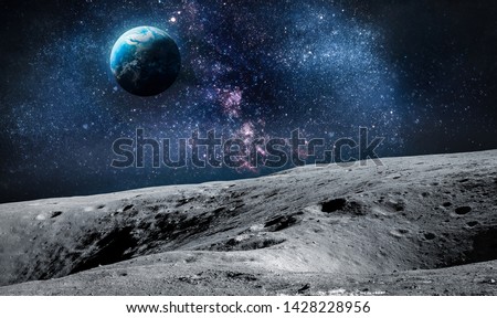 Surface of Moon. Planet Earth on background. Space collage. Elements of this image furnished by NASA.