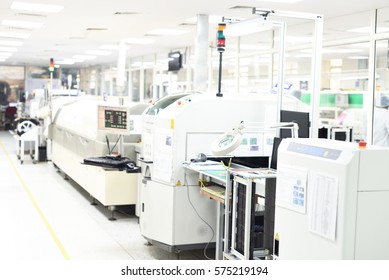 Surface mount technology assembly line also called SMT line for manufacturing and production of electronic equipment, PCB assemblies, fully automated pcb manufacturing line for electronics.   - Shutterstock ID 575219194