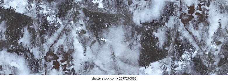 Surface of natural stone under snow in winter. Top view. Banner. - Powered by Shutterstock