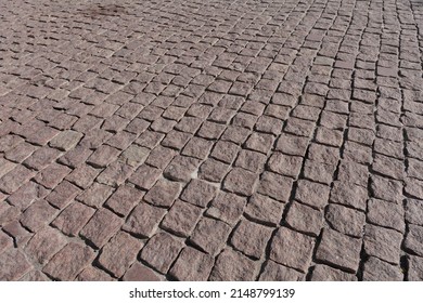 Surface Of An Old Cobblestone Road