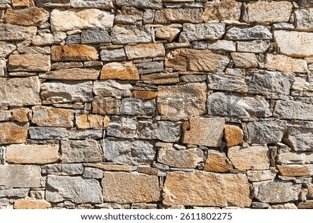 The surface of an old stone wall, perfect for the background.