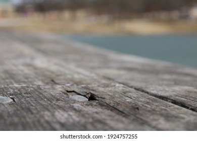 The surface of an old table with bolts