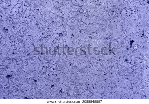 surface of porous\
stone wall resembles frost in its structure. color is tinted\
17-3938 Very Peri. trend of 2022. Purple, lilac, lavender color.\
Stone with pattern of\
frost