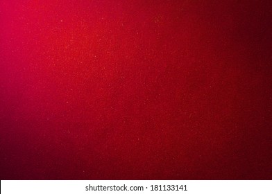 The surface of the red velvet cover on the poker table