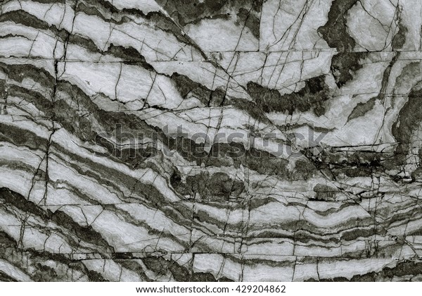 Surface rocks by the sea / Multicolored rock in\
natural pattern,The mix of colors in the form of natural black and\
white stone