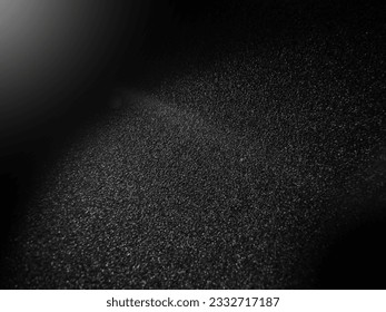 The surface was rough and white light was reflected from the fire. perspective and black background