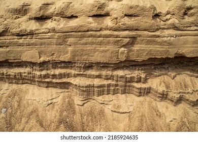 Surface Sandy Shore. Close-up Of Sandy Rock.