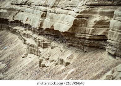 Surface Sandy Shore. Close-up Of Sandy Rock.