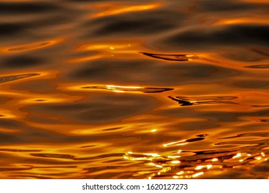 Surface of the sea at sunset