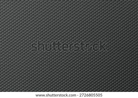 Surface shows a dark colored texture with a diamond pattern that covers the entire area evenly.