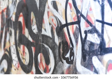 Surface of street wall with graffit - abstract colored drawings on walls of city