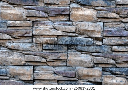 The surface texture of the foundation cladding made of wild stone.