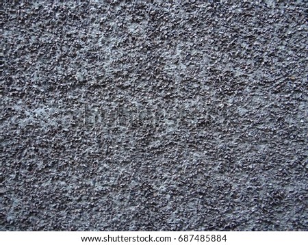 Surface texture interspersed with gravel.